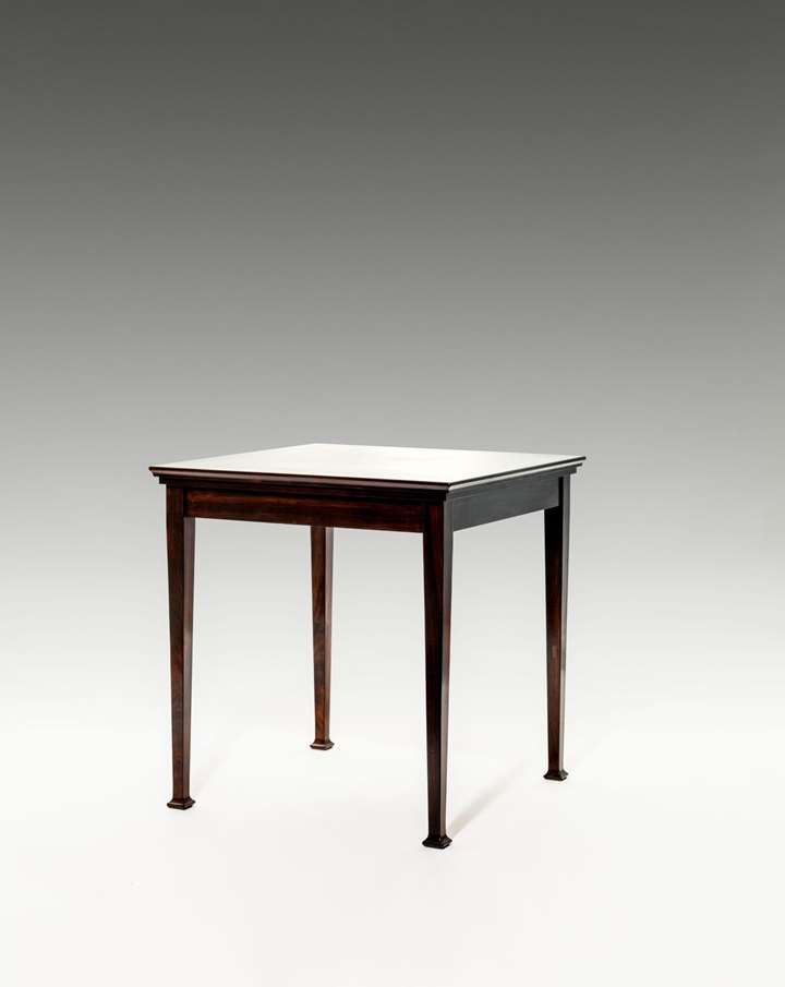 TABLE "KÖLN" from
FURNITURE FOR A GENTLEMEN’S STUDY
consisting of: bookcase, desk and chair, side table, long case clock
